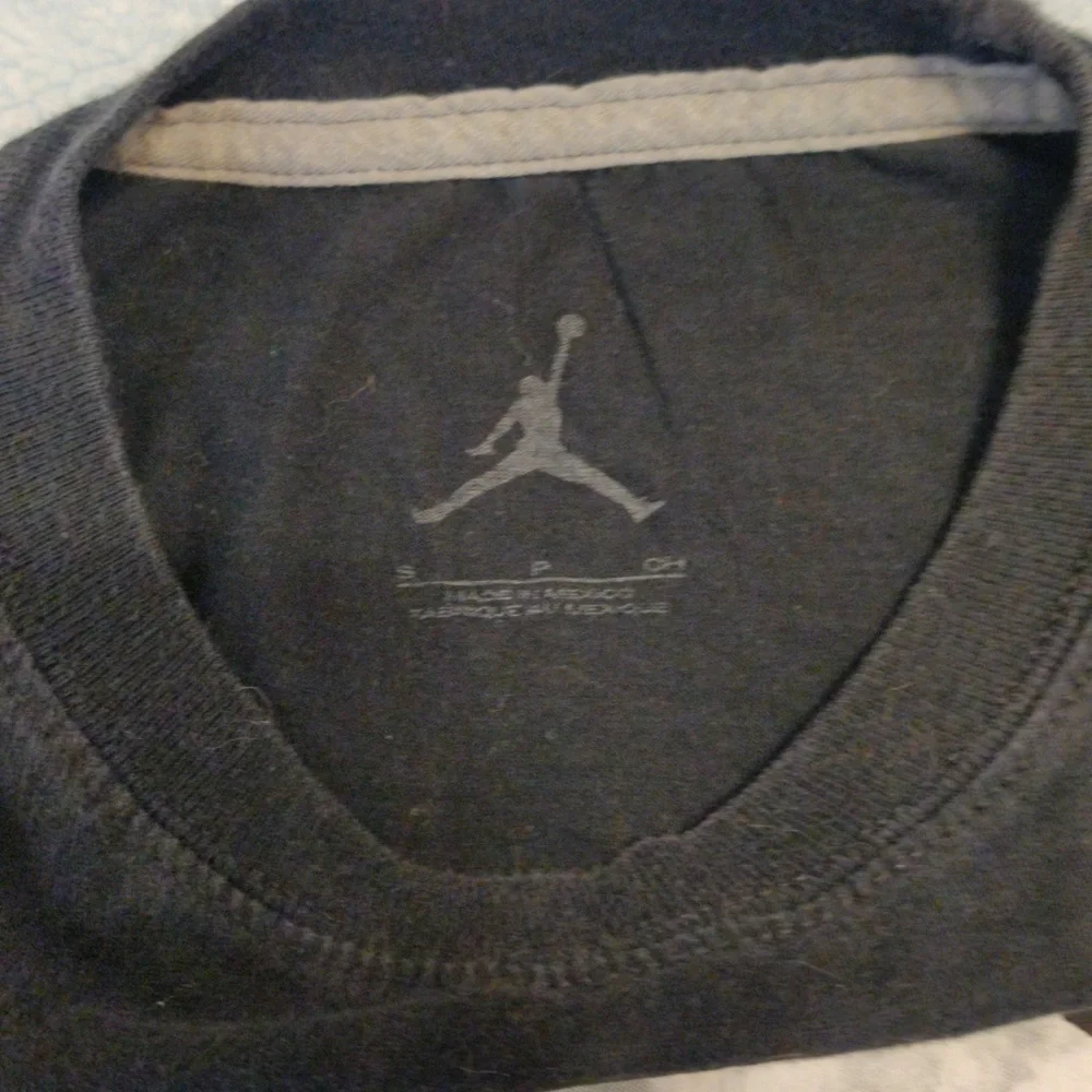 Jordan shirt with Chicago displayed in the middle